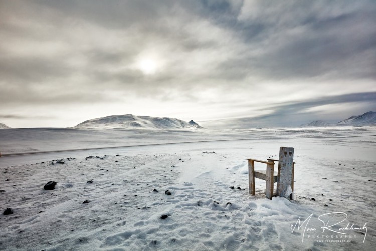 Lonely Chair in snowy Landscape